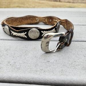 vintage Western black and brown leather concho belt with white braided lacing...